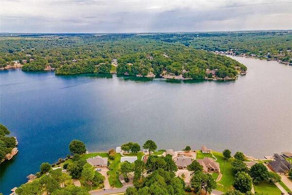 Come kick your feet up by the Lake on your own .36 acre lot!!