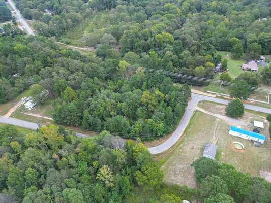 1.41 Acre Wooded Corner Lot with Stream & Power Available